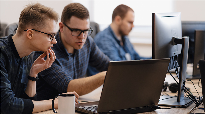 Group of Man working on thier Laptops